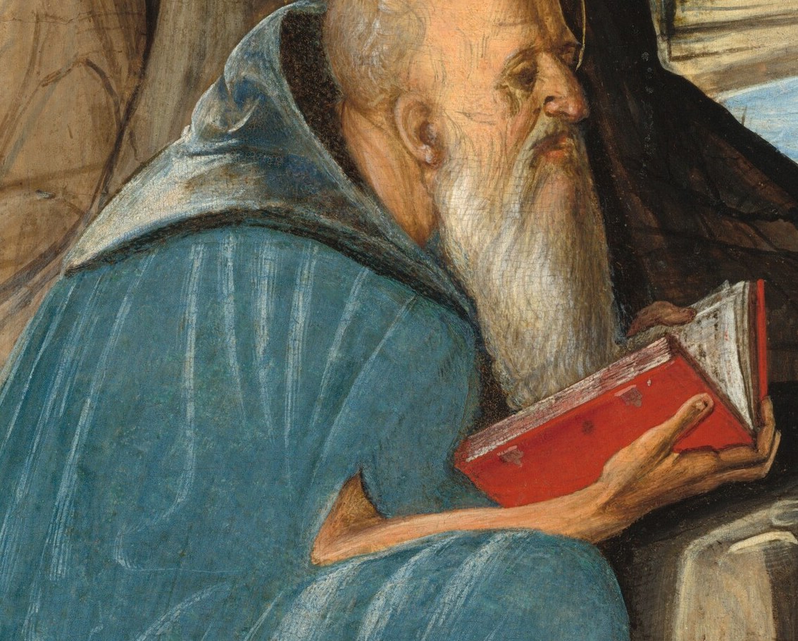 Now look at the hands that hold the book.