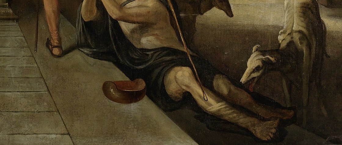Outside, Lazarus begs, his body covered in sores.