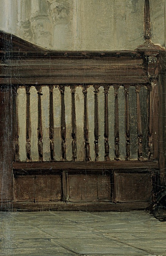 Its solid, dark form contrasts with the light-filled architecture, hinting at the passage of time and use.