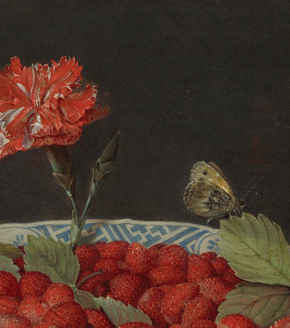 A red carnation crowns the mound: the symbol of betrothal.