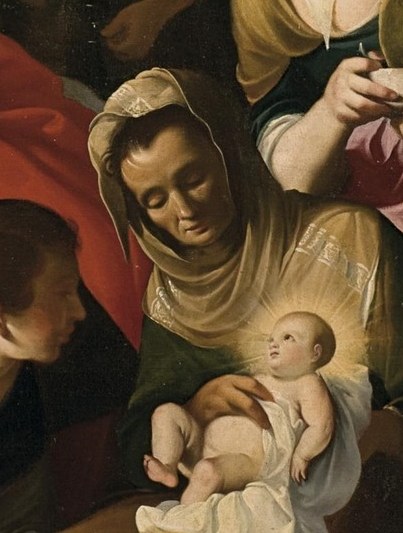 Her gentle gaze and posture convey maternal love and tenderness.