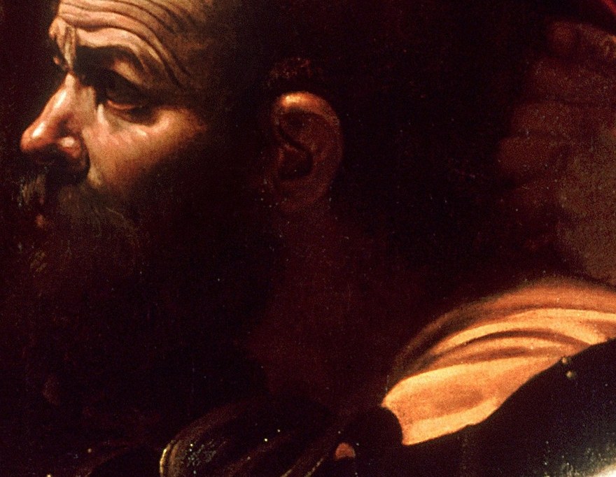 The act of betrayal is made intimate and disturbing by the close proximity of his face.
