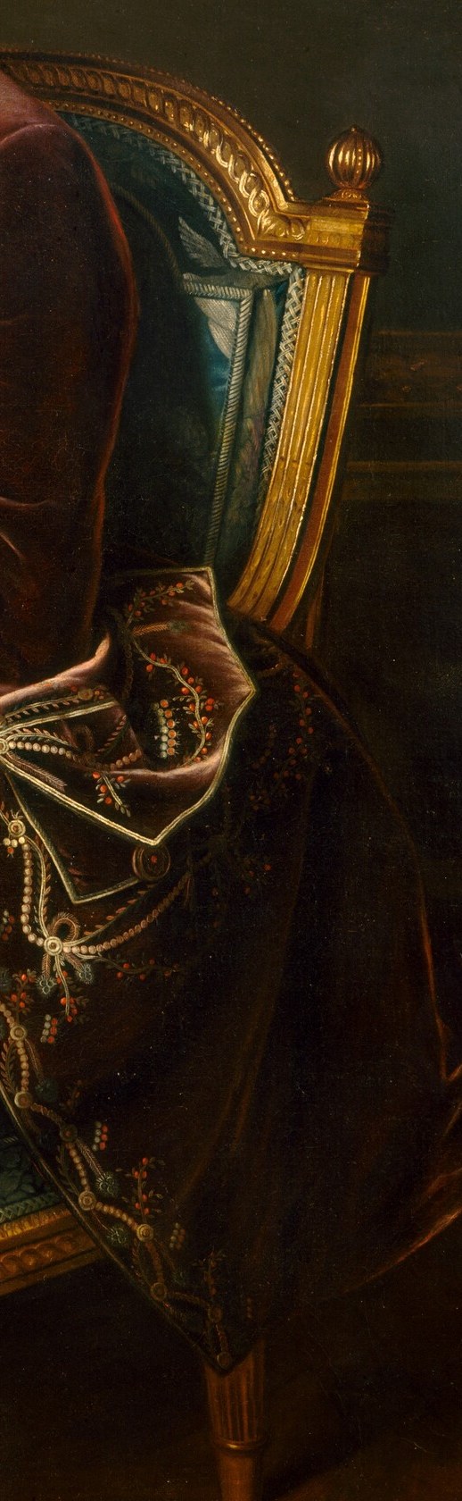 The gilded, carved details of the chair signify luxury and comfort, reinforcing the Marquis's status.