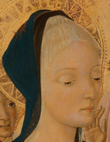 Archetypal Sienese linear elegance , the long nose, pale oval, and tilted gaze encode contemplative grief even in a tender moment; a close-up reveals how little paint it takes to carry emotion.