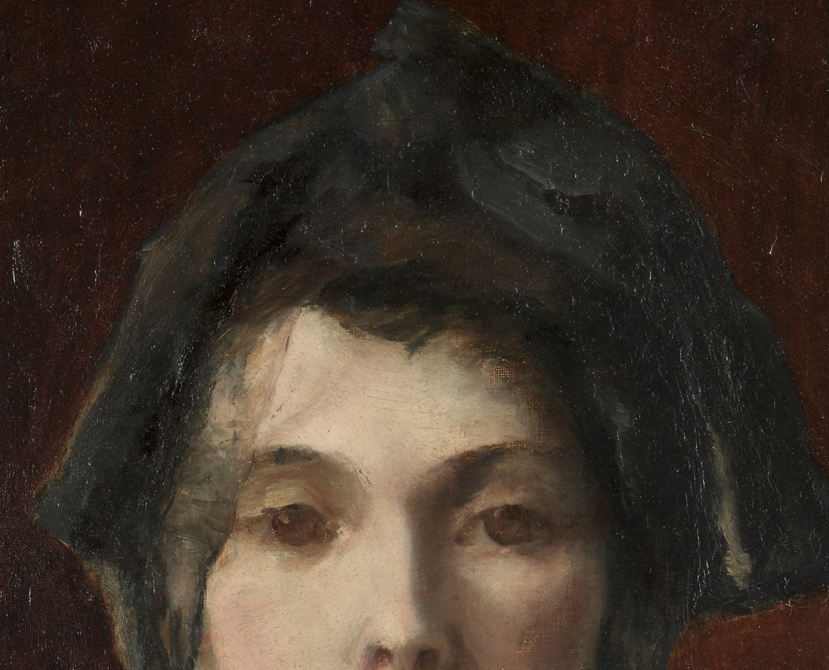 Her dark hat casts shadows, adding mystery.