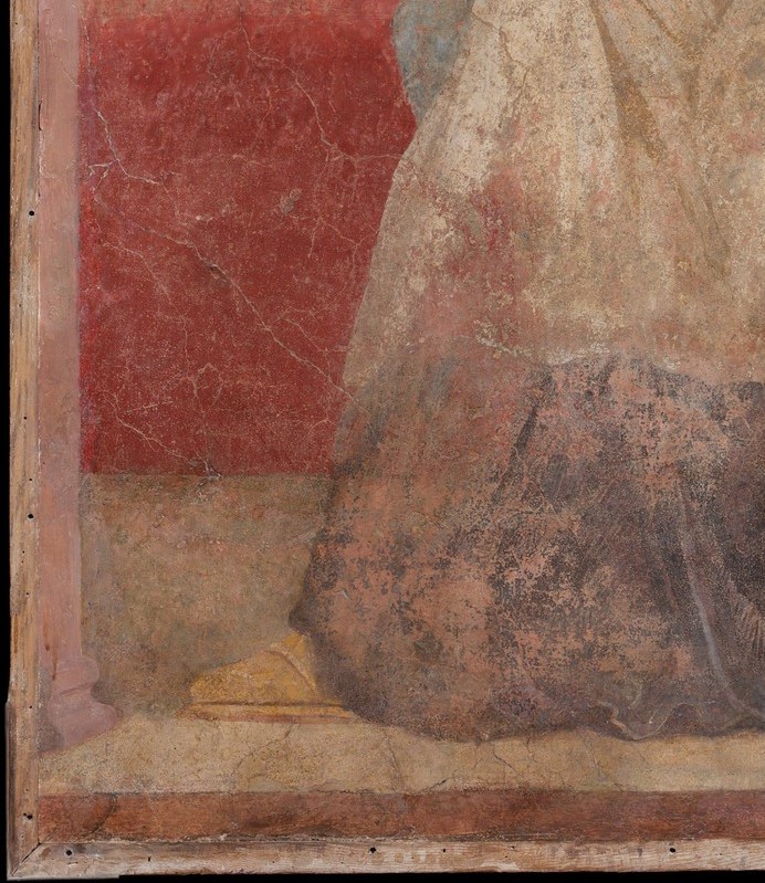 The visible craquelure and paint loss document the fresco's physical survival , excavated in 1900 and later cut from the wall , giving the image an archaeological texture that coexists with the artistry.