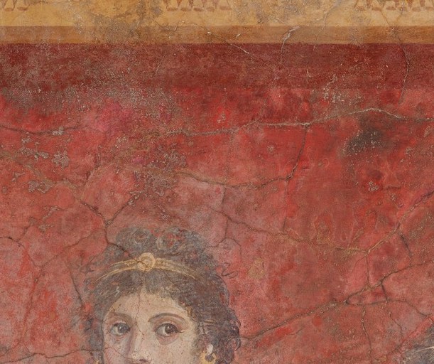 Her direct, serene gaze and crown mark her as a figure of high status , possibly a Hellenistic queen or muse; the impressionistic brushwork gives her face unusual liveliness for a fresco.