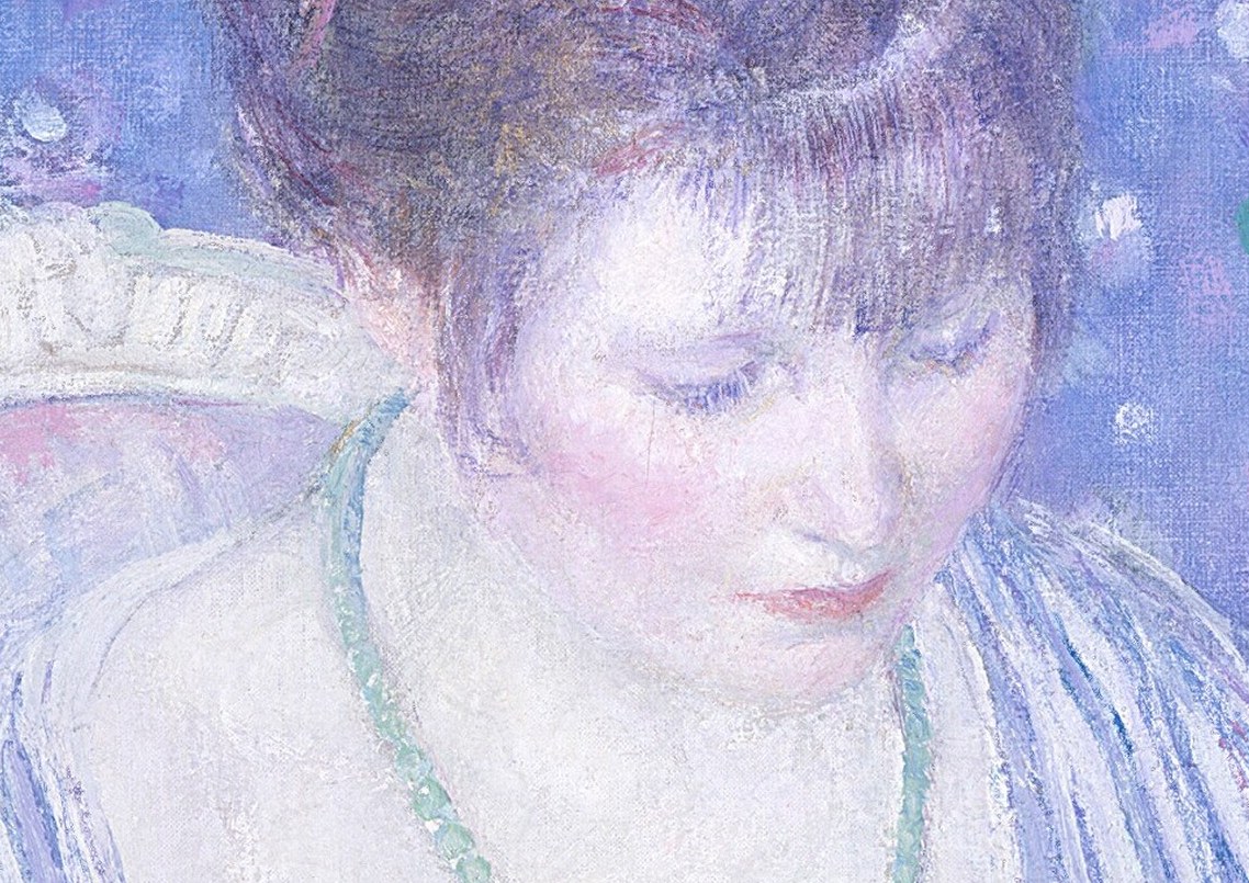 Her downward gaze suggests gentle contemplation of their beauty.