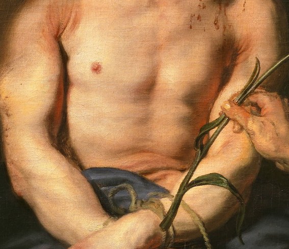 The way his hands are bound and his posture convey a sense of helplessness and the physical restraint he endures.