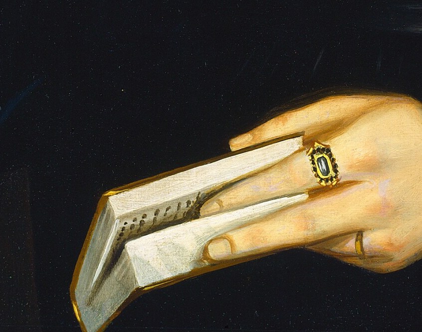 In her hands, a folded paper, perhaps a letter.