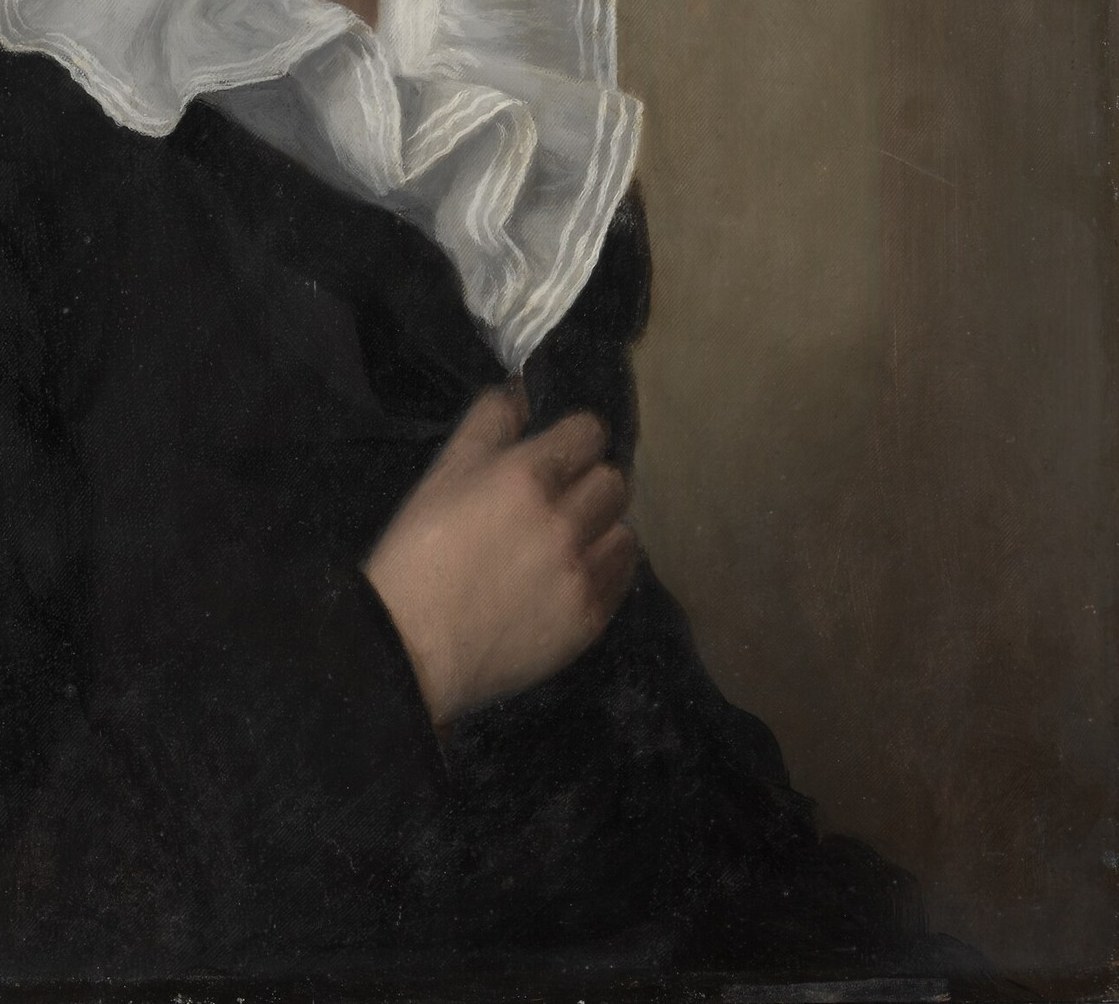 Such formal attire was common for portraits of the era.
