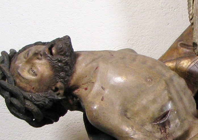 The thorns are still on his head, humiliation even after death.