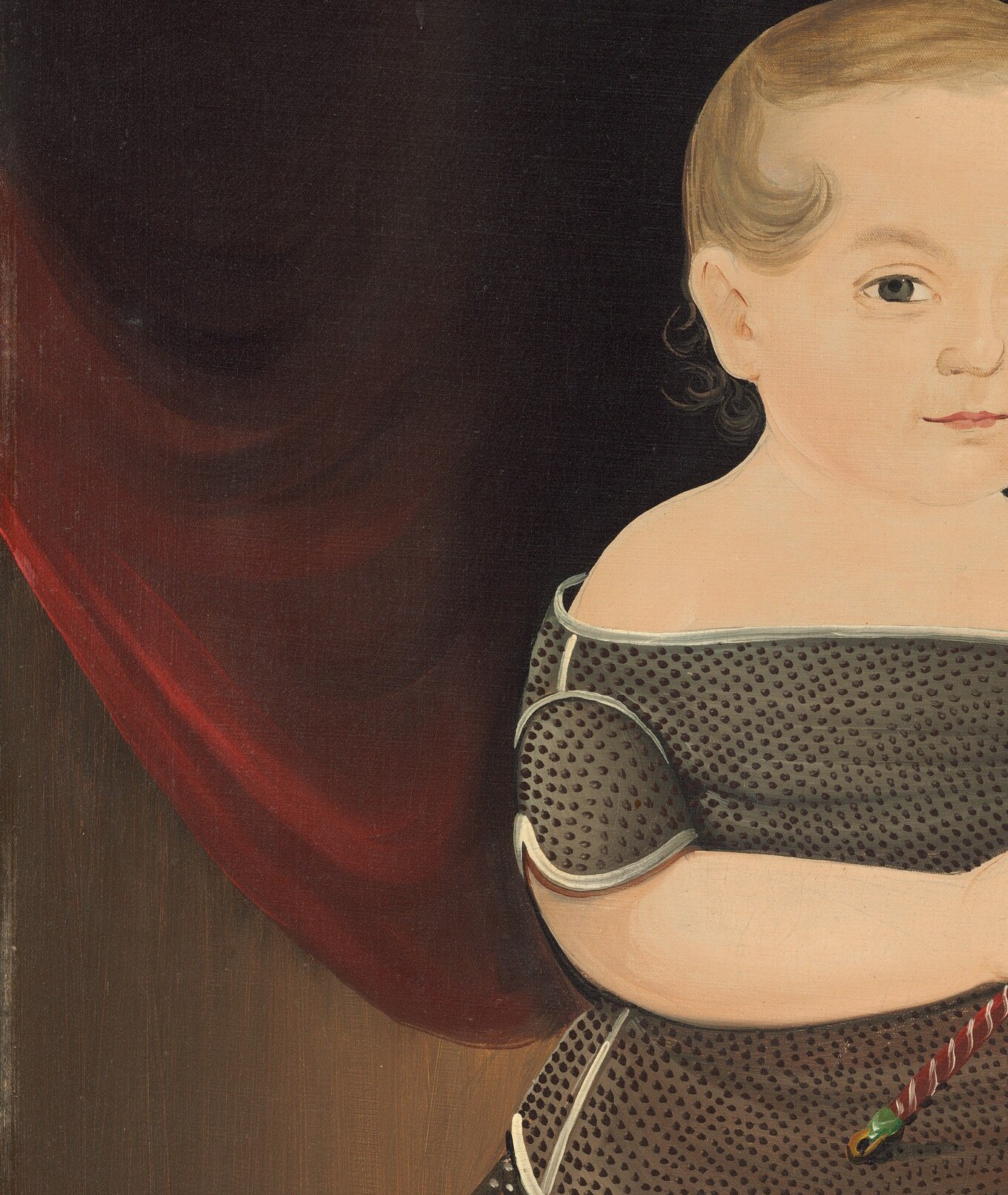 But look at the theatrical red curtain behind the boy.
