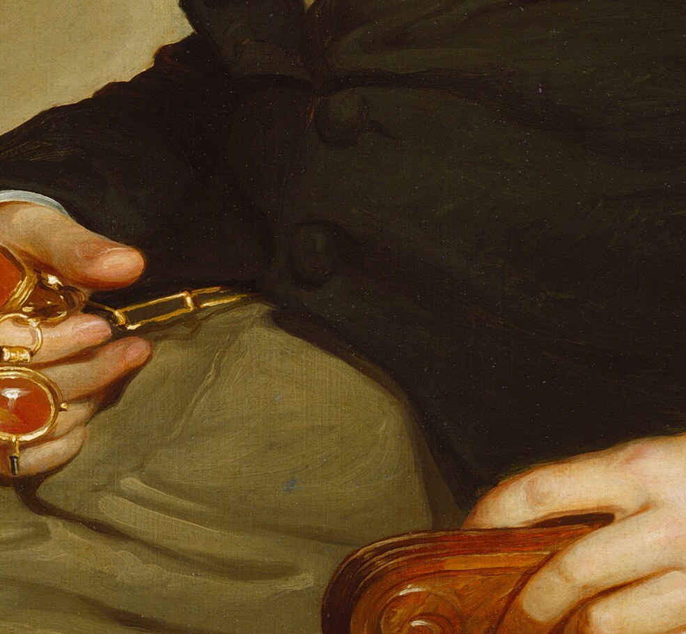 Papers in hand, steady gaze, everything about this portrait says permanence.