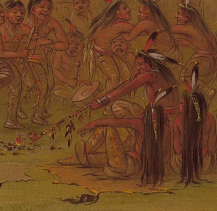 Here, an Assiniboine dancer performs a pipe dance.