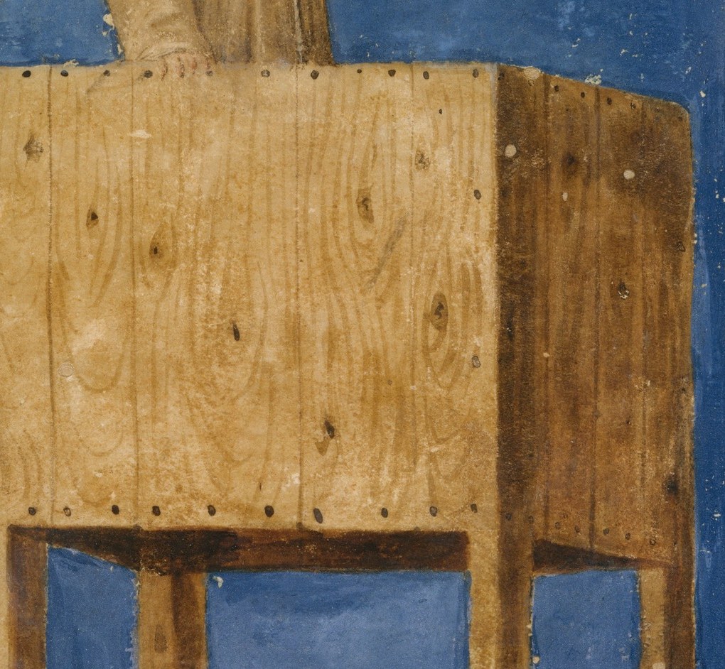 Look closely at the rough wood of the pulpit.