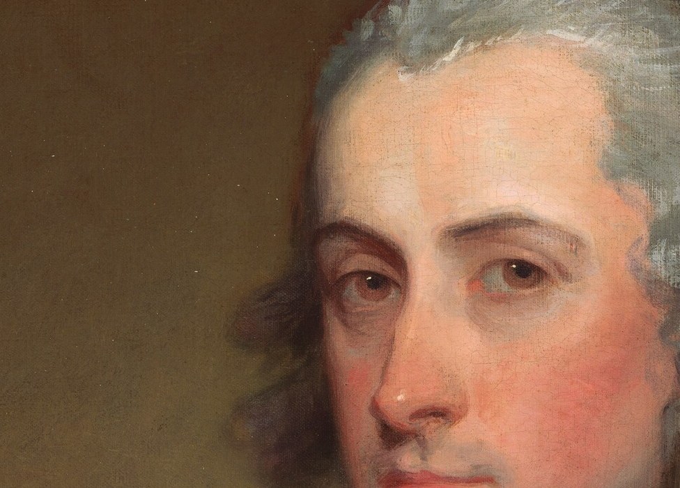 But the slight tension in his chin hints at a deeper complexity.