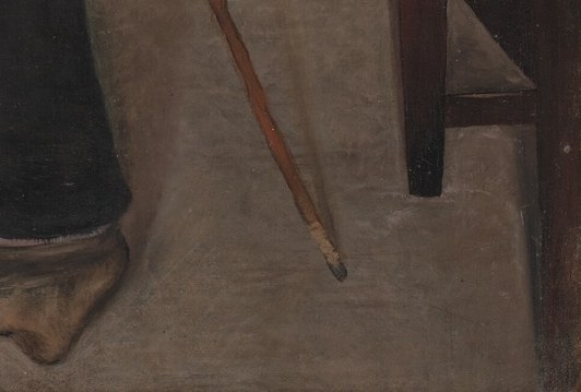 He wears clogs and holds a walking stick.