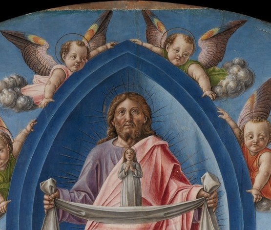The gilded halo is incised with delicate, tooled patterns.