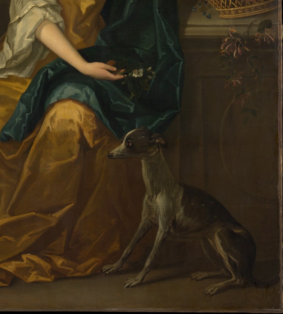 Look at the rich folds and lustrous fabric of her yellow gown.