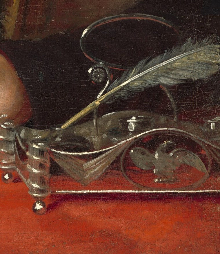 His quill and inkwell symbolize the power of written word.