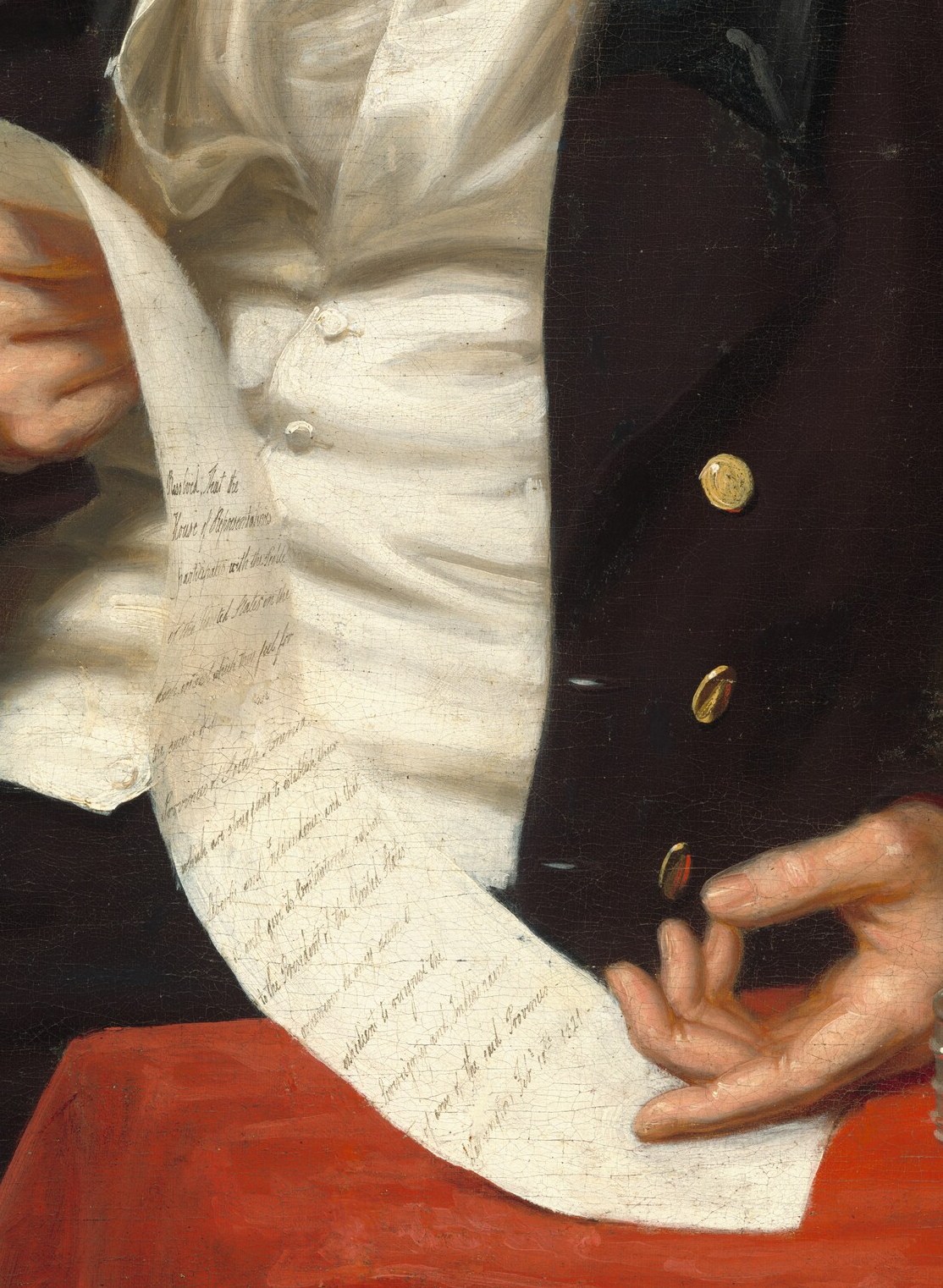 The paper in his hands alludes to his political discourse.