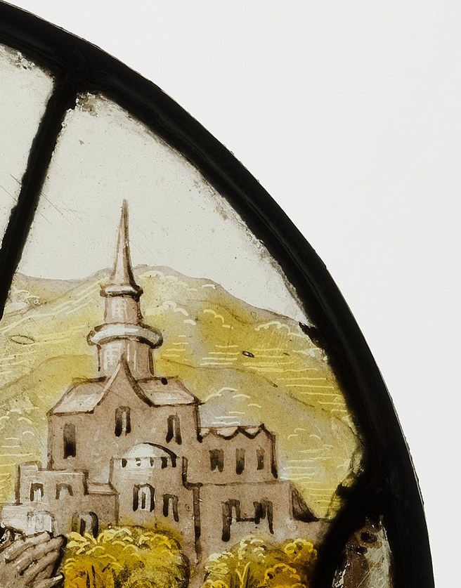 The same church stands finished in the background.