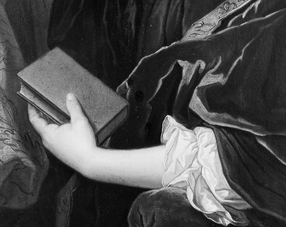 The closed book and white cloth signal piety and a life of devotion.