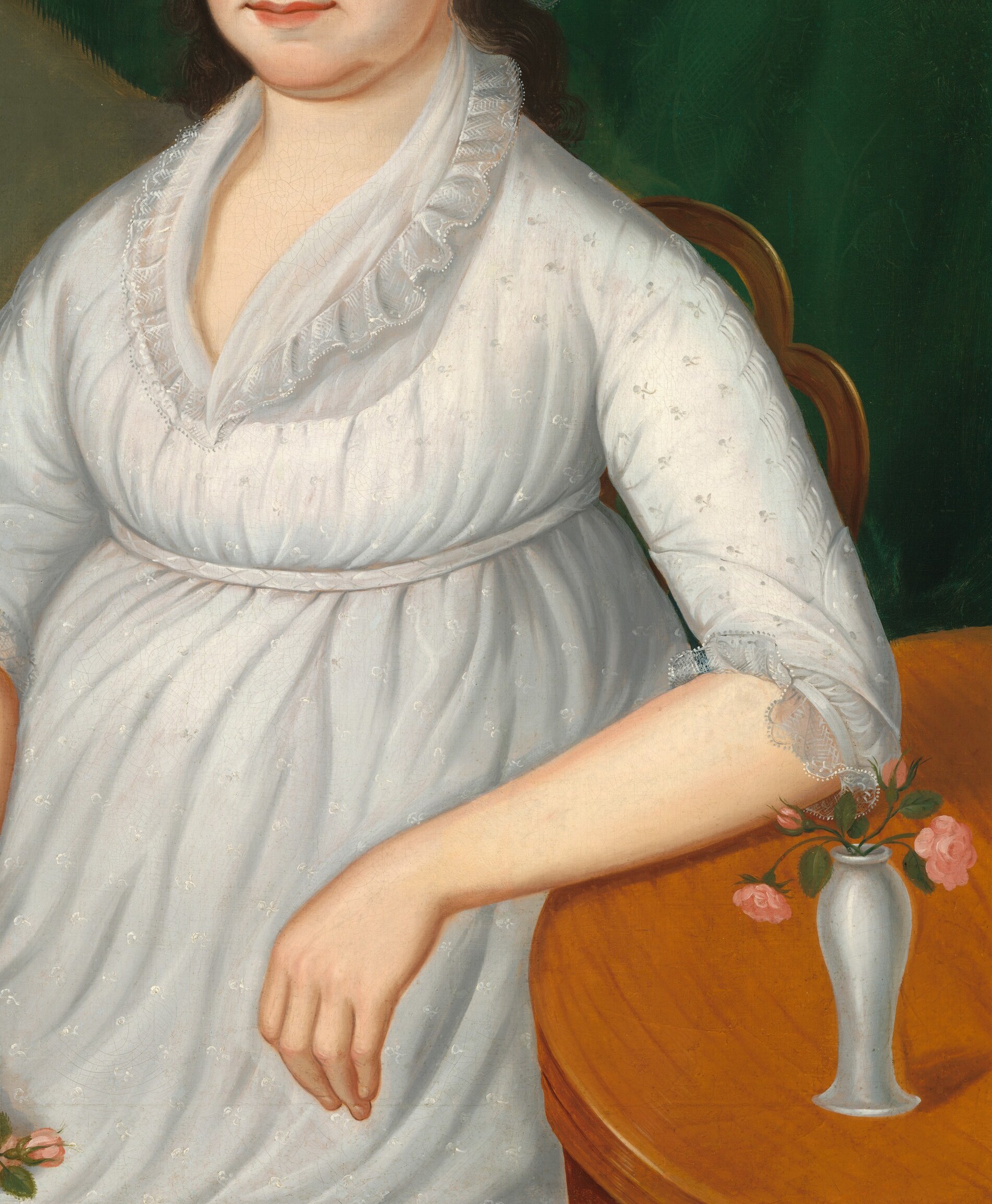 The soft white dress reflects early 19th-century American fashion.