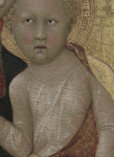 His right hand is raised in a formal gesture of blessing.
