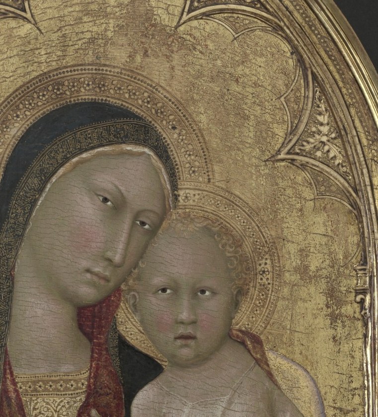 He wears a cruciform halo, a marker unique to Christ.
