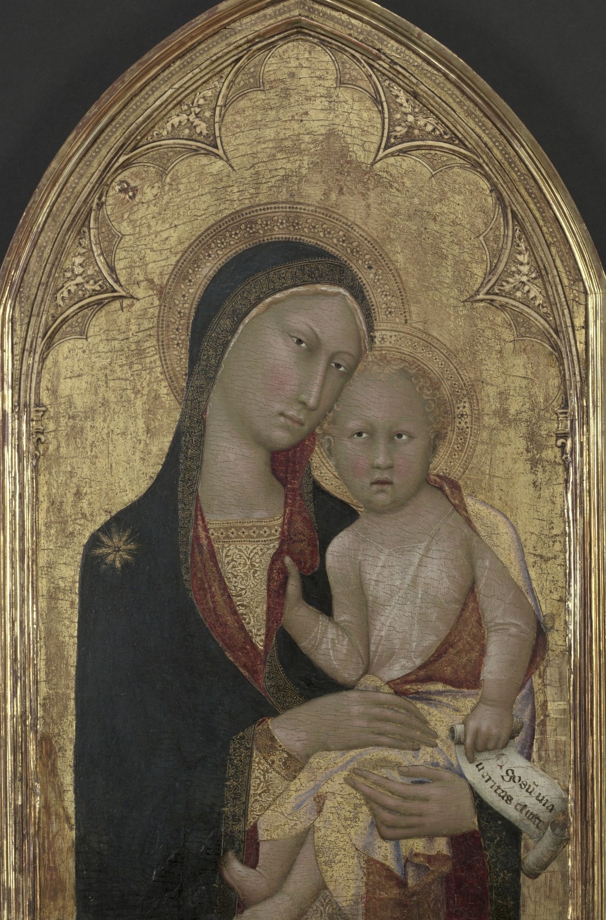 The gold background: not sky, but divine light made material.