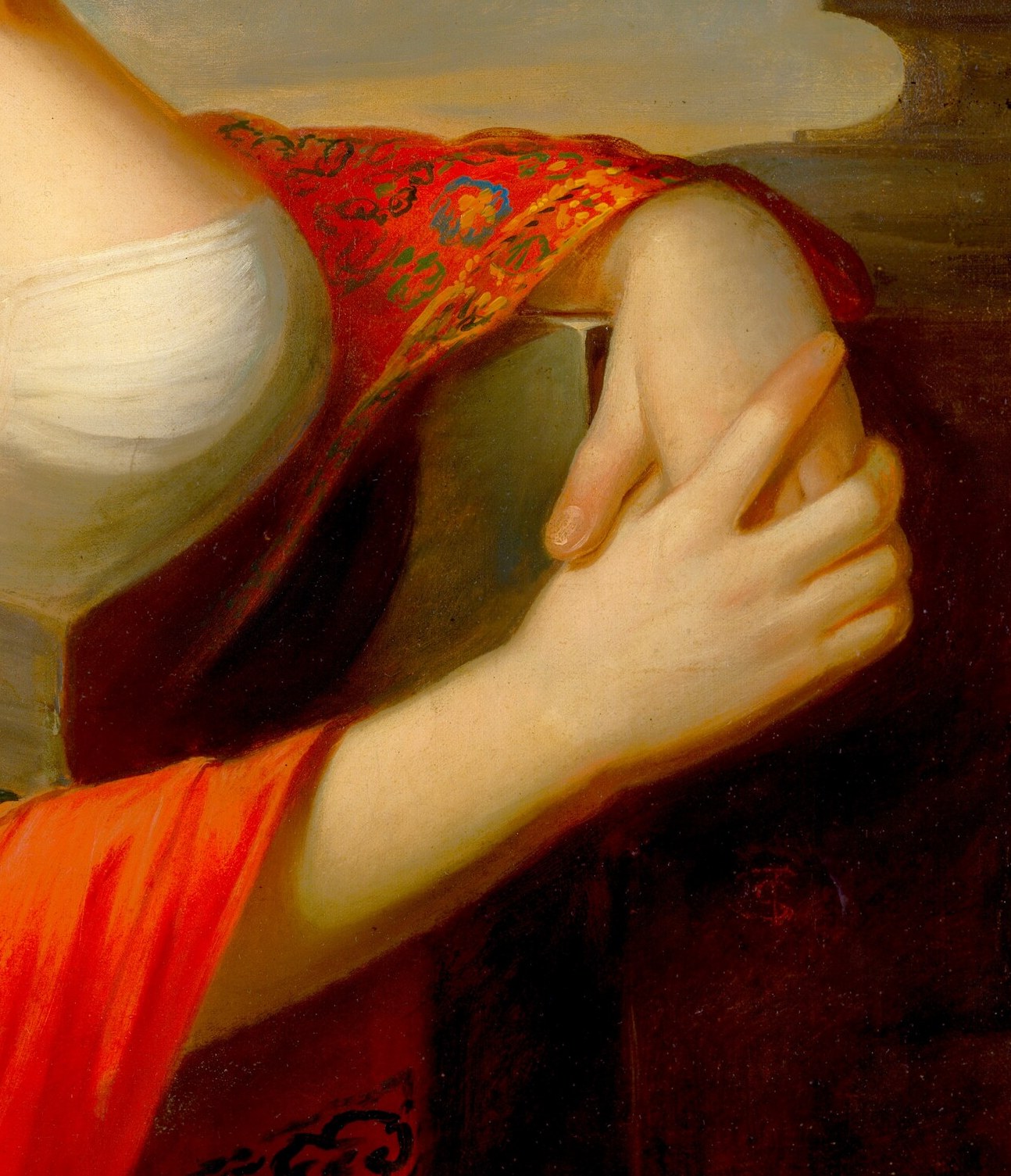 Her dress is modest, but her shawl is vibrant and exotic.