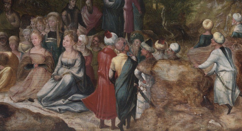 Yet, a small figure draws a vast, attentive crowd.