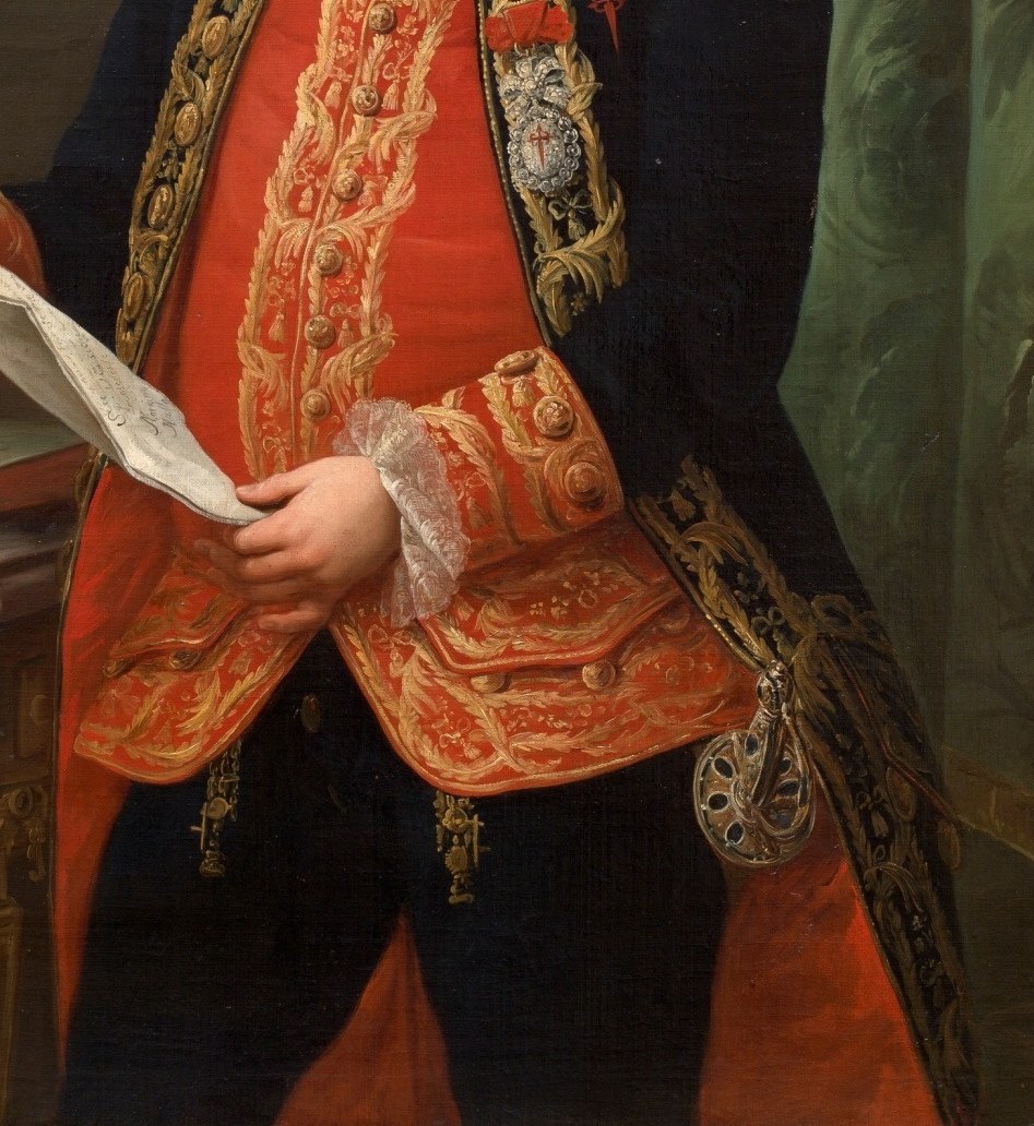 His red and gold coat reflects his noble status.