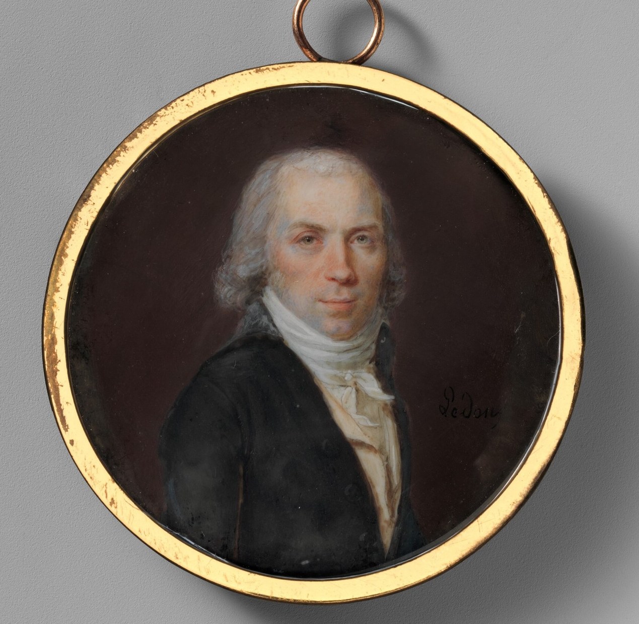 The ornate, gilded frame encloses the portrait, adding to its preciousness and historical context.