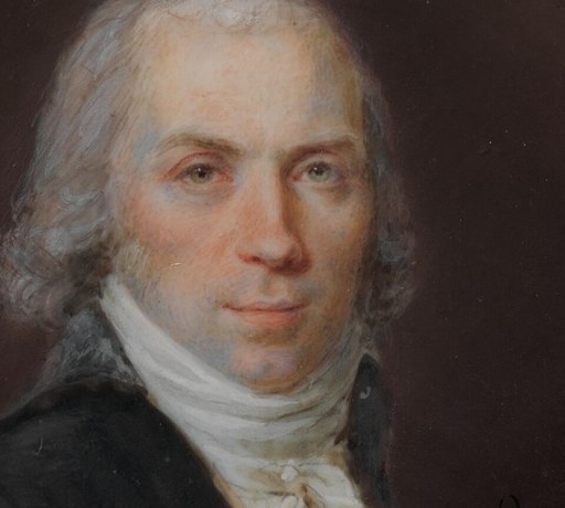 The direct gaze and subtle expression convey a sense of introspection and gravitas.
