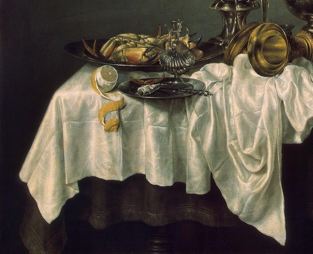 The largest tonal mass in the painting; its rumpled folds are rendered with the same deliberate care as the metalwork , controlled disorder that anchors the composition and reflects light upward onto the objects above