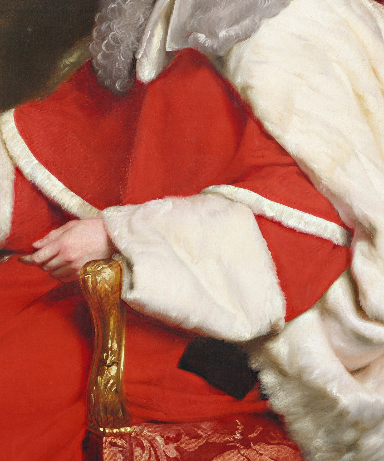 The rich, vibrant red fabric with its white fur trim is a striking visual element, symbolizing authority and ceremony.