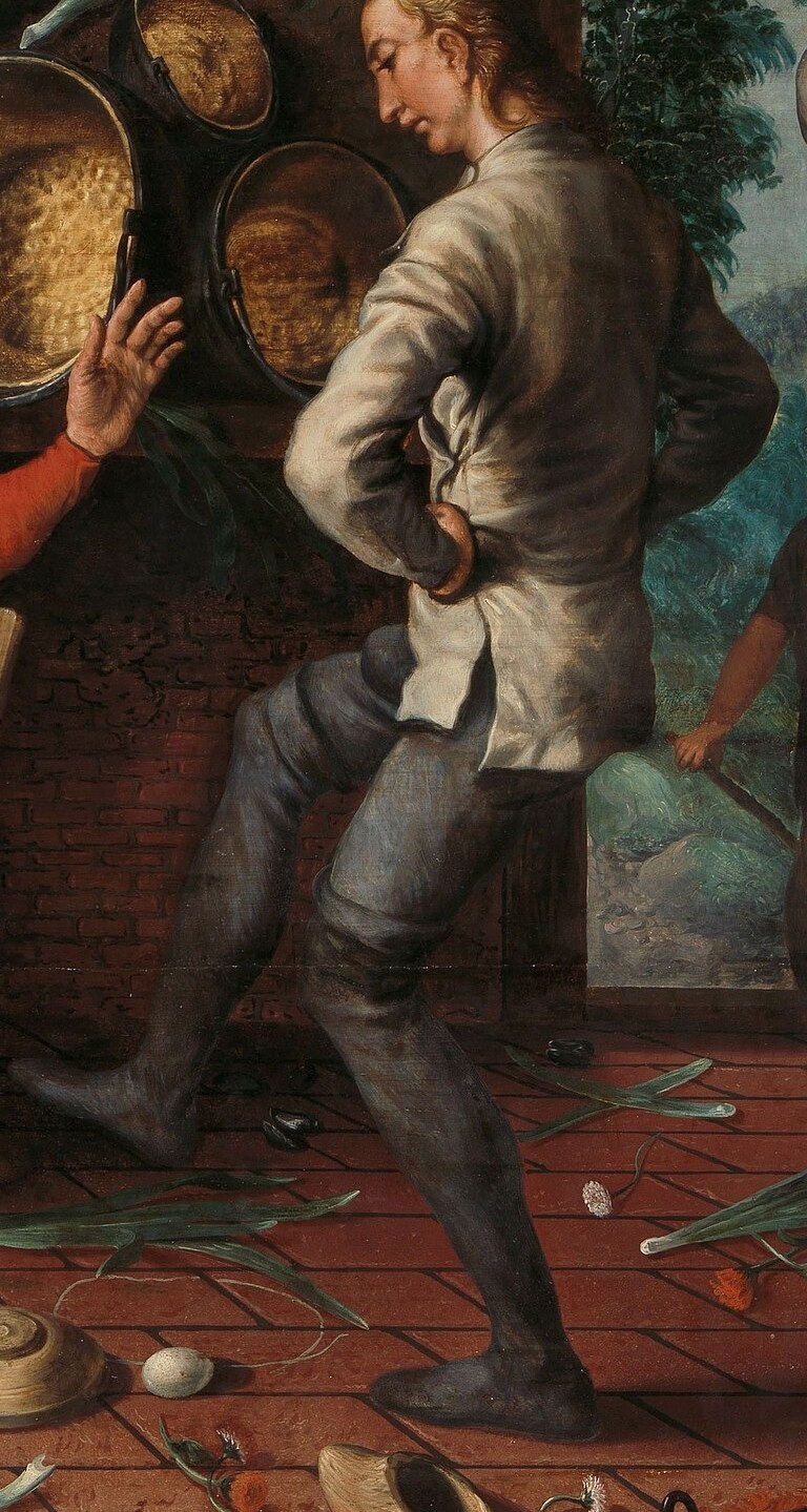 Look closely at the man in the grey coat.