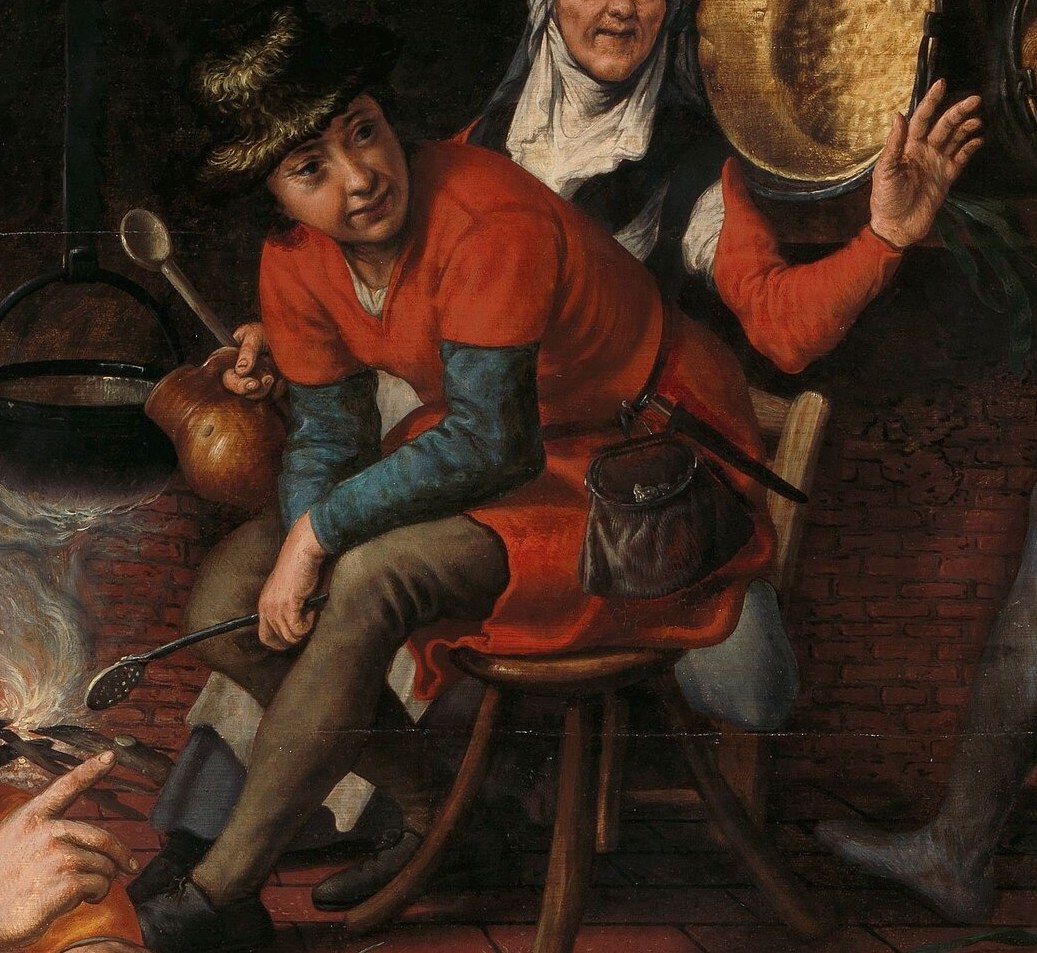 He is seated and appears to be holding a tool, possibly preparing for the dance or observing the proceedings with a relaxed posture.