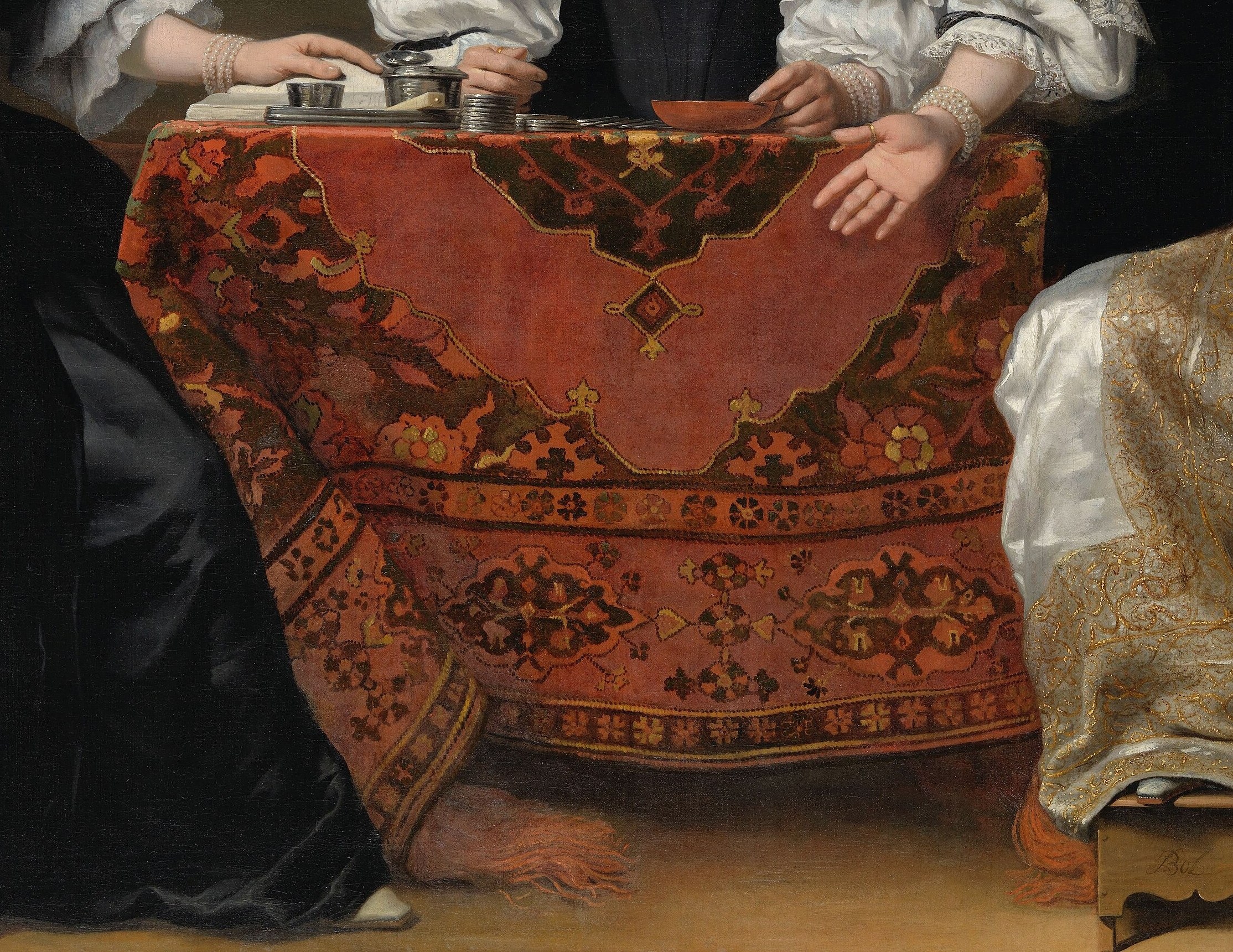 The ornate carpet on the table signals the institution's wealth.