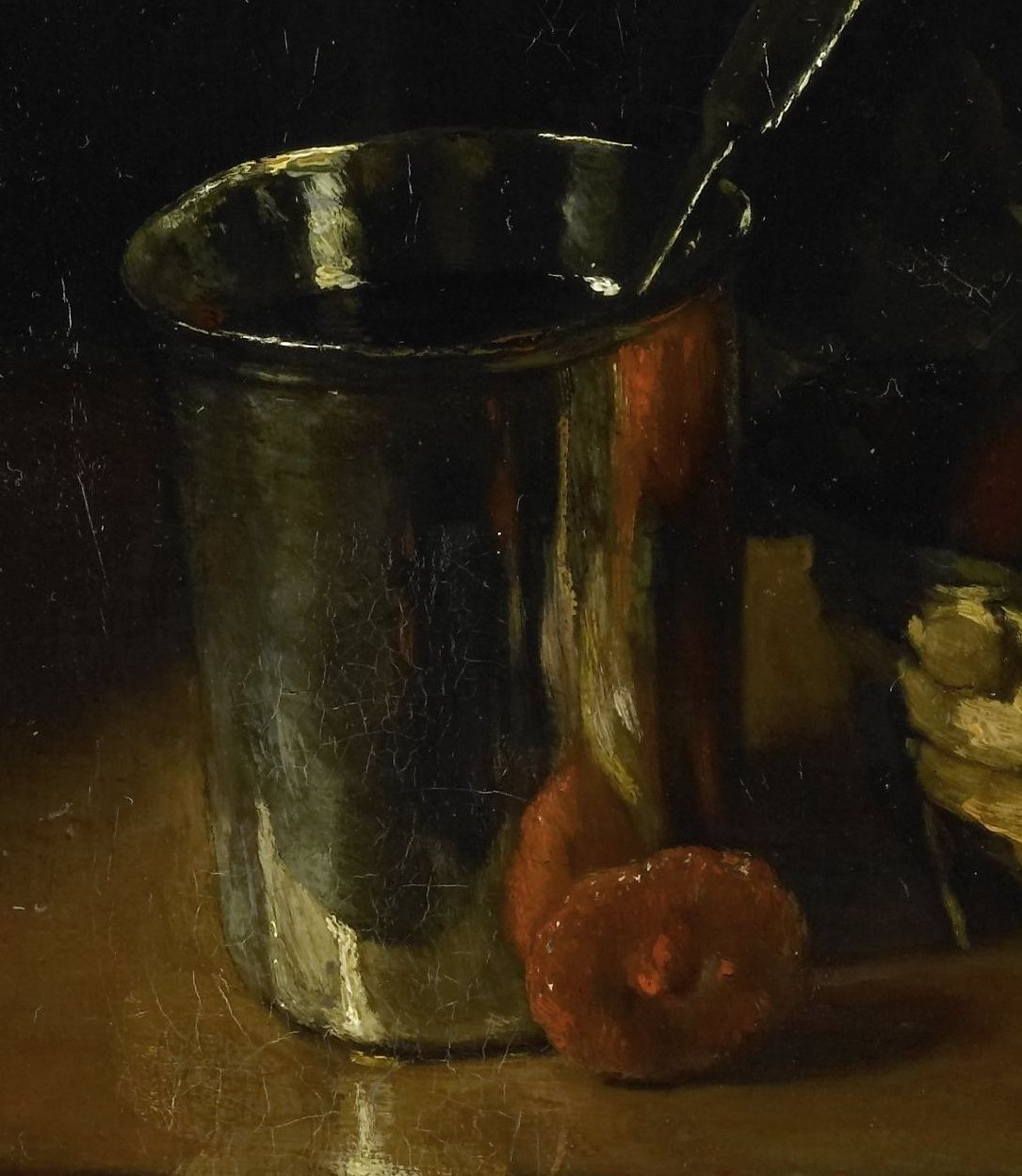 Look closely at the gleaming silver beaker.