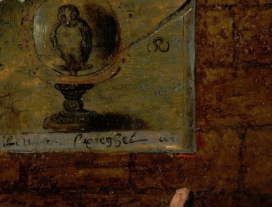 Behind the food, two tiny paintings hang on the wall.