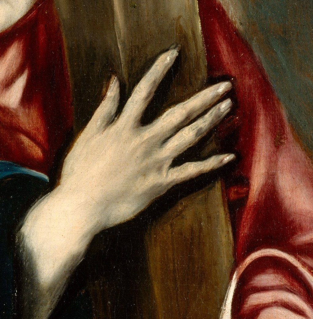 Look at his hands. He is not carrying the cross; he is holding it.