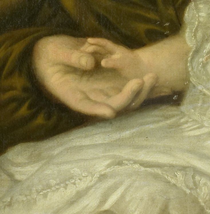 Her protective hand emphasizes the strong bond with her child.