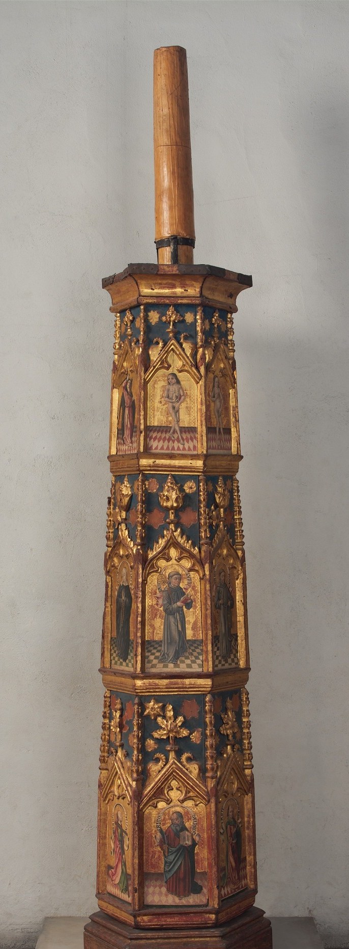 Viewed as a single form the object reads unmistakably as a Gothic tower , every tier steps slightly inward; the architectural metaphor transforms a liturgical utensil into a portable sacred building.