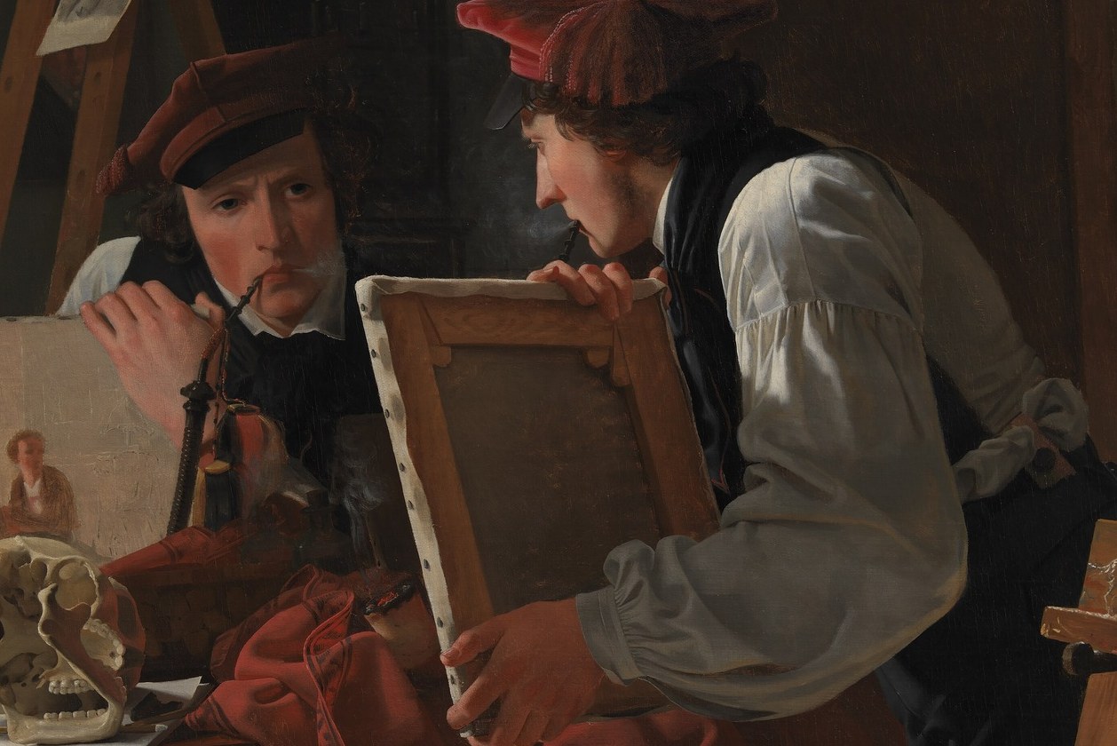 He holds a sketch to a mirror, scrutinizing his own drawing.
