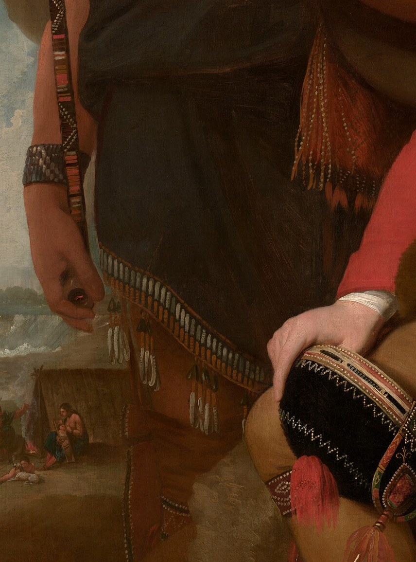 He points to a peace pipe. Johnson holds a musket. The bargain is visible.