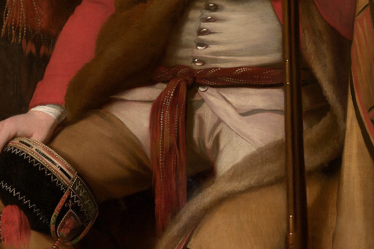 So he showed up in a redcoat, then layered it with a wampum belt.